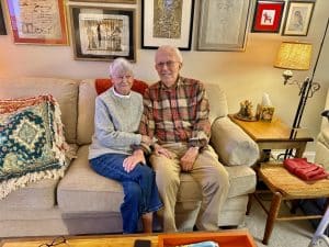 Elderly couple sitting on couch
