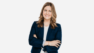 Person in blazer with arms crossed